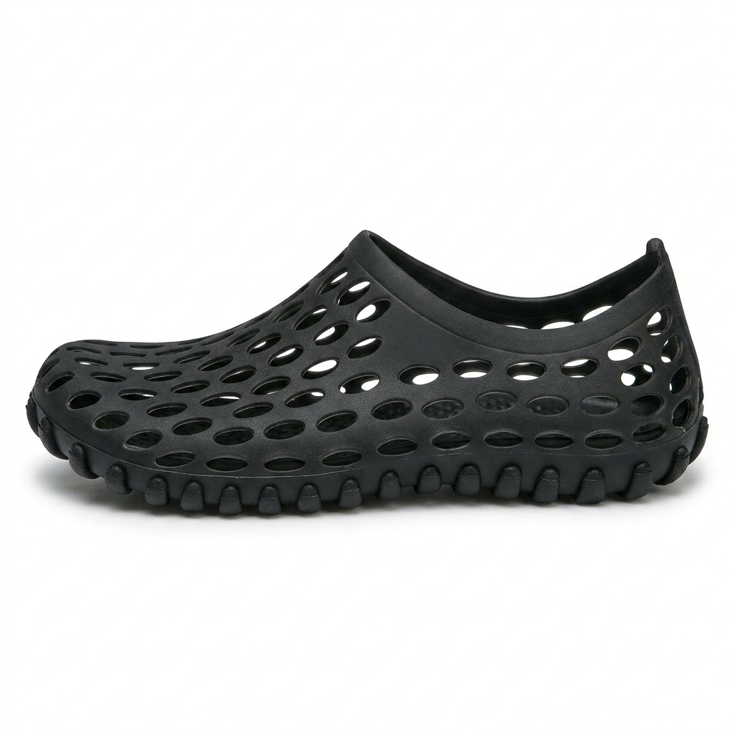 Zapatos de agua unisex en negro, zueco de goma perforada, vista lateral