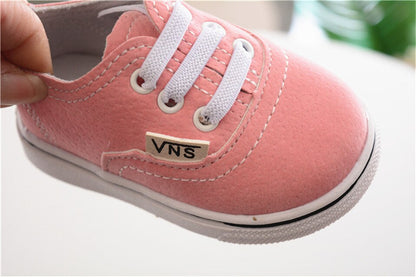 zapatos bebe estilo vans rosa lateral suela blanca